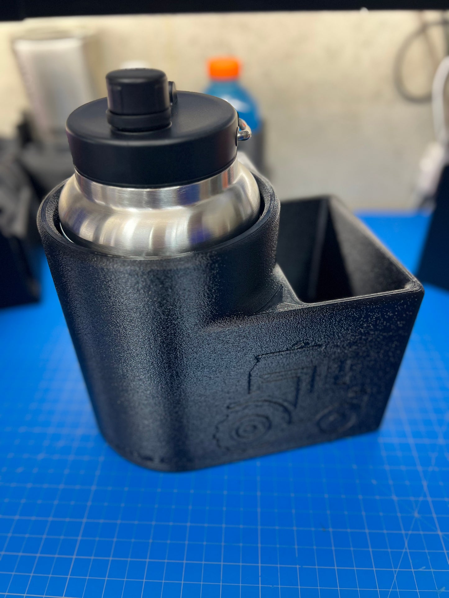 Inner Fender mounted 5 and 3/8 drink holder with bin